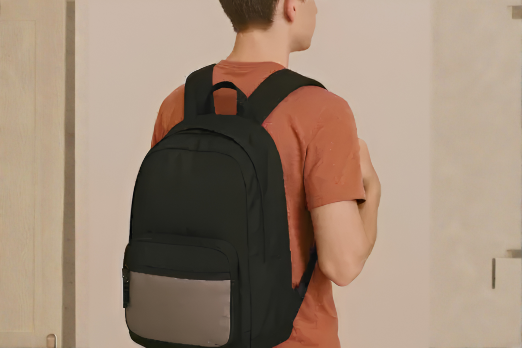 Student wearing a backpack correctly with both padded shoulder straps in use